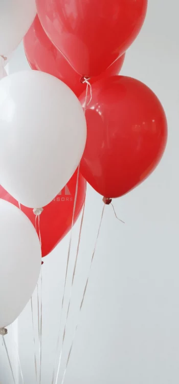 balloons in red and white celebrating All Sensors GmbH